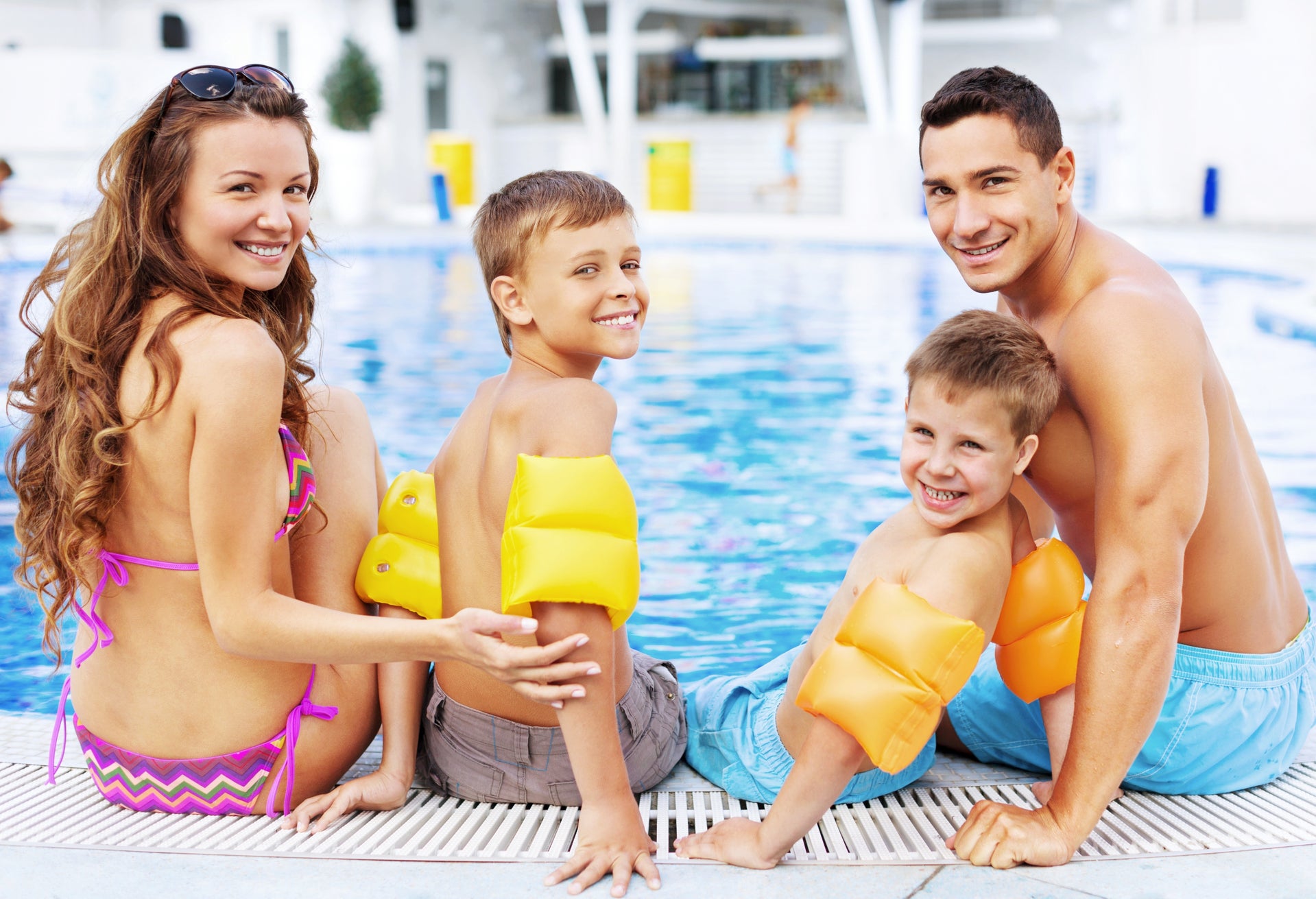Family together pool Lifestyle. New Homes in Haines City, FL